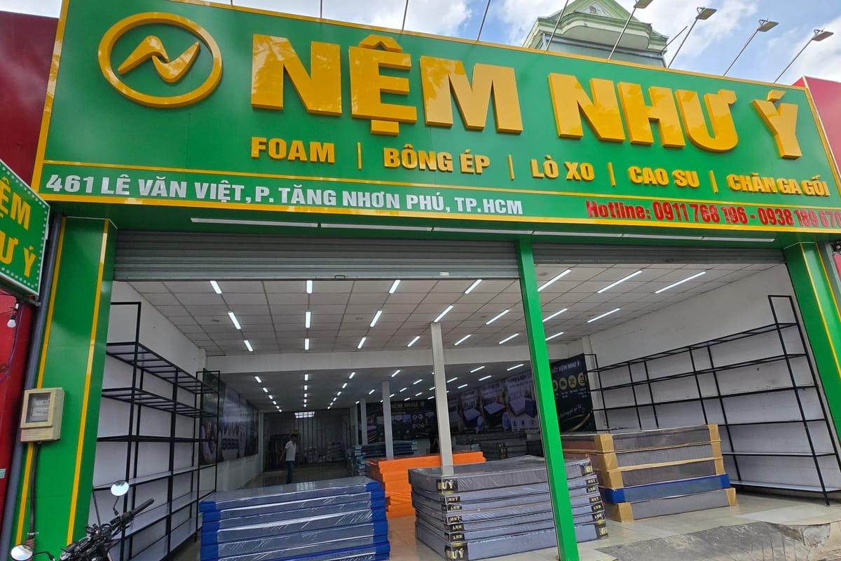 Biển hiệu Nệm Như Ý: foam, bông ép, lò xo, cao su, chăn ga gối — 461 Lê Văn Việt